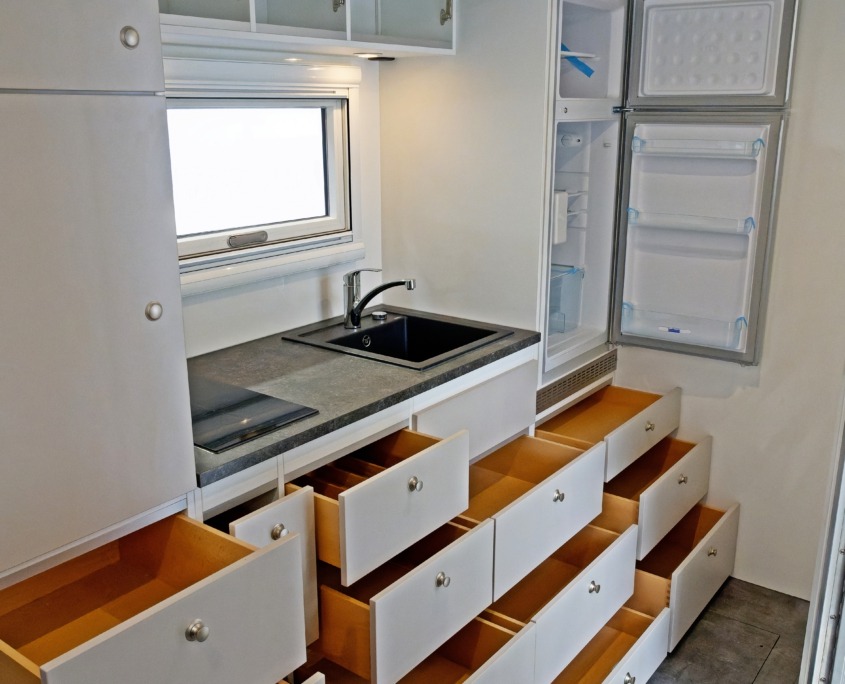 Kitchen with opened drawers