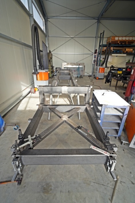 Intermediate frame cut and welded for expedition vehicle