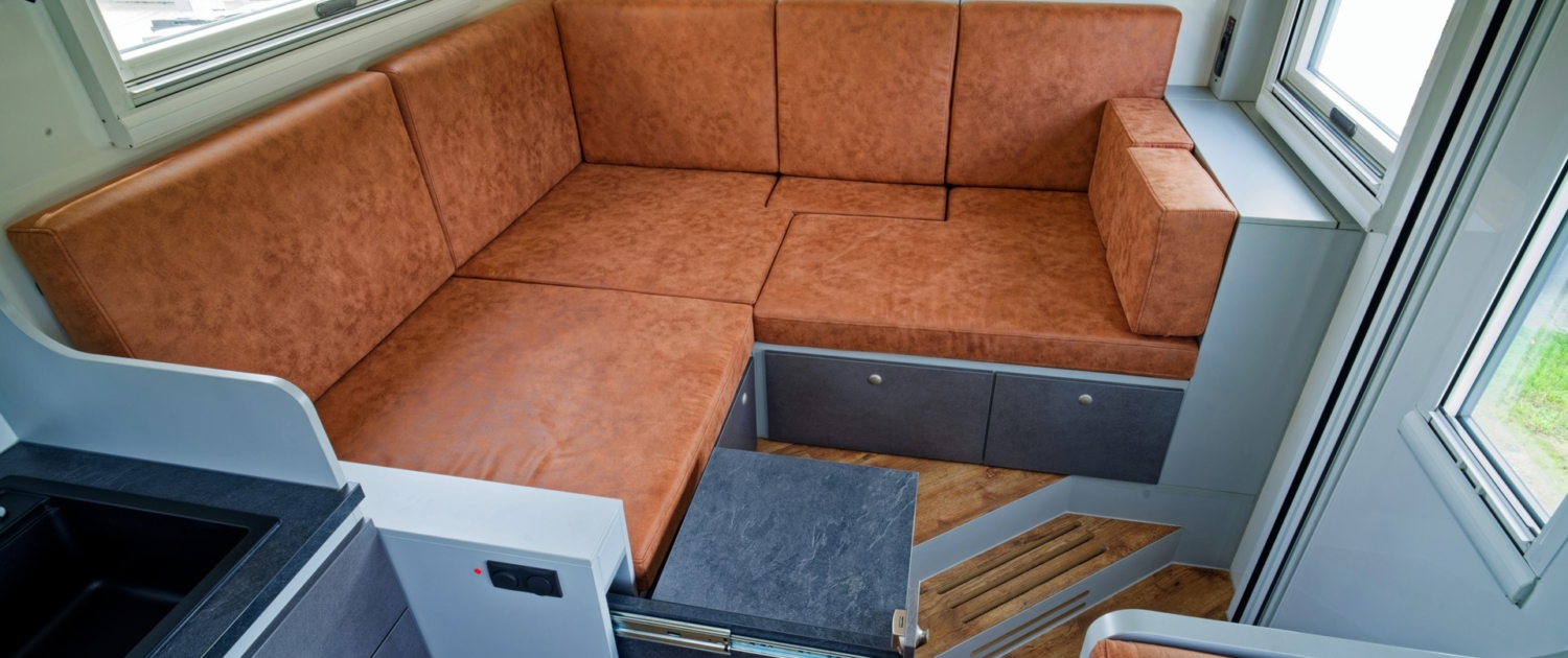 Expedition vehicle Alberts 82LDX living area with storage
