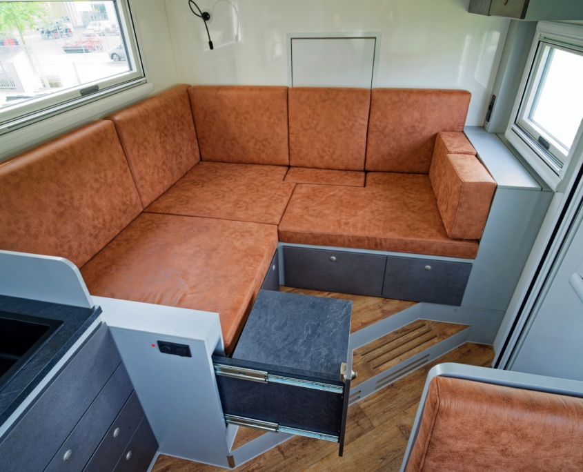 Expedition vehicle Alberts 82LDX living area with storage
