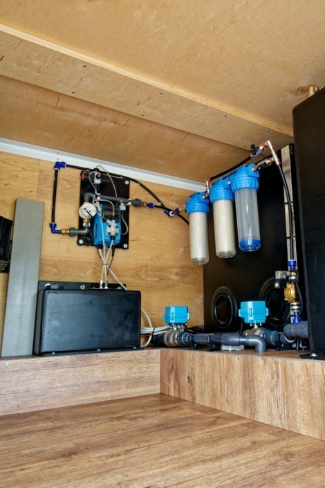 Water treatment system installed in the storage space under the bed