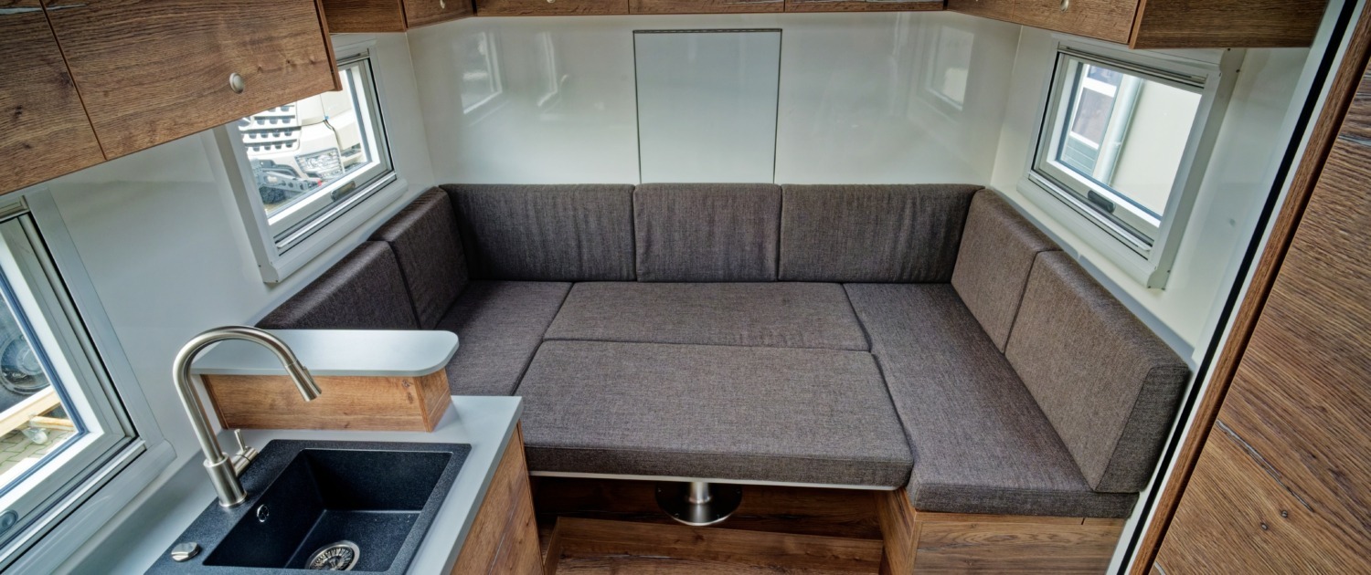 Expedition vehicle Alberts 60UQX seating group as a bed