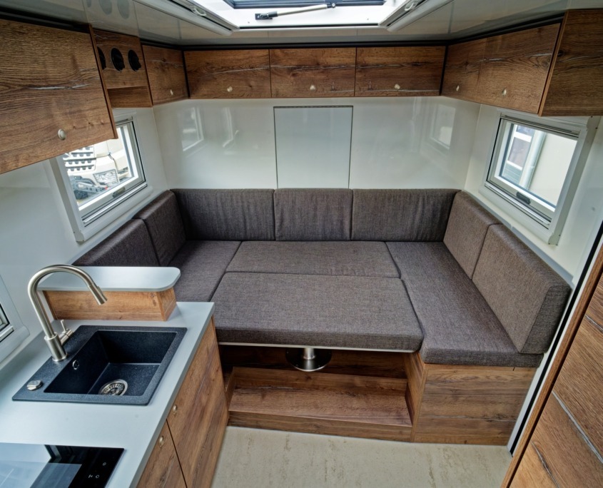 Expedition vehicle Alberts 60UQX seating group as a bed
